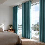 Aquamarine Blue Linen Grommet Bedroom Curtains in a Bright Minimal Bedroom with Soft White Walls and Oatmeal Bedding - Blackout Lining
