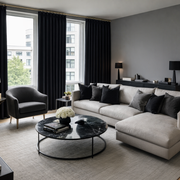 Black Velvet Pinch Pleat Blackout Curtains in a Living Room with Grey Walls