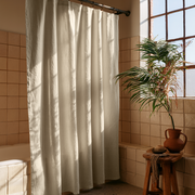 Cream Linen Button Hole Top Weighted Shower Curtain in a Warm Terracotta Tiled Bathroom