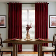 Dark Deep Red Velvet Dining Room Curtains in a Dining Room with Light Gray Walls and a Brown Dining Table, Red Flower Vase
