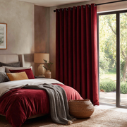 Dark Deep Red Velvet Grommet Blackout Curtains for Sliding Doors in a Bedroom with Beige Walls
