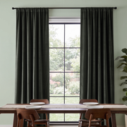 Dark Grey Velvet Curtains in a Spacious Dining Room with White Walls and a Large Brown Table
