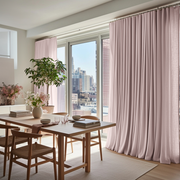 Dusty Pink Linen S-Fold Curtains for Sliding Doors in a Dining Room with Off-White Walls