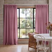 Dusty Rose Linen Pinch Pleat Dining Room Curtain in a Contemporary Dining Room with White Brick Walls, a Woven Rattan Chair and a Lush Garden View - Cotton Lining