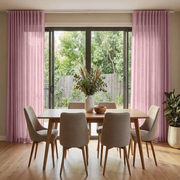 Dusty Rose Linen S-fold Dining Room Curtain in a Contemporary Dining Room with Neutral Beige Walls, a Rectangular Wooden Table and Grey Upholstered Chairs.