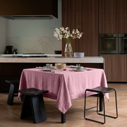 Dusty Rose Square Linen Tablecloth in a Modern Kitchen with Dark Wood Cabinetry and Black Stools