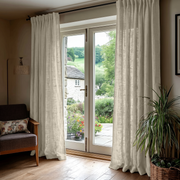 Ecru Heavy Weight Linen Back Tab Extra Long Curtains in a Rustic Living Room with Stone Walls and Garden Views