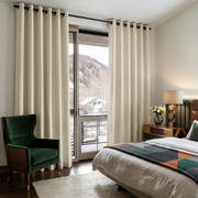 Ecru Heavy Weight Linen Grommet Curtains in a Mountain Bedroom With a Green Velvet Chair and Balcony Doors - Blackout Lining