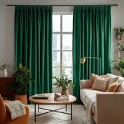 Emerald Green Velvet Pinch Pleat Blackout Curtains in a Living Room with Off-White Walls