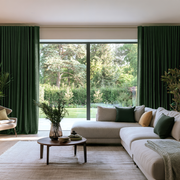 Forest Green Linen Back Tab Extra Long Curtains in a Modern Living Room with Large Beige Sectional Sofa and a Round Wooden Coffee Table With a Vase