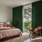 Forest Green Linen Grommet Bedroom Curtains in a Bright Contemporary Bedroom with Blush Pink Bedding, a Sculptural Wood Lounge Chair, and Terracotta Accents - Cotton Lining
