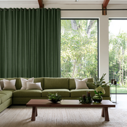 Forest Green Linen Grommet Extra Long Curtains in a Contemporary Living Room with Green Sectional Sofa and Floor-to-Ceiling Windows
