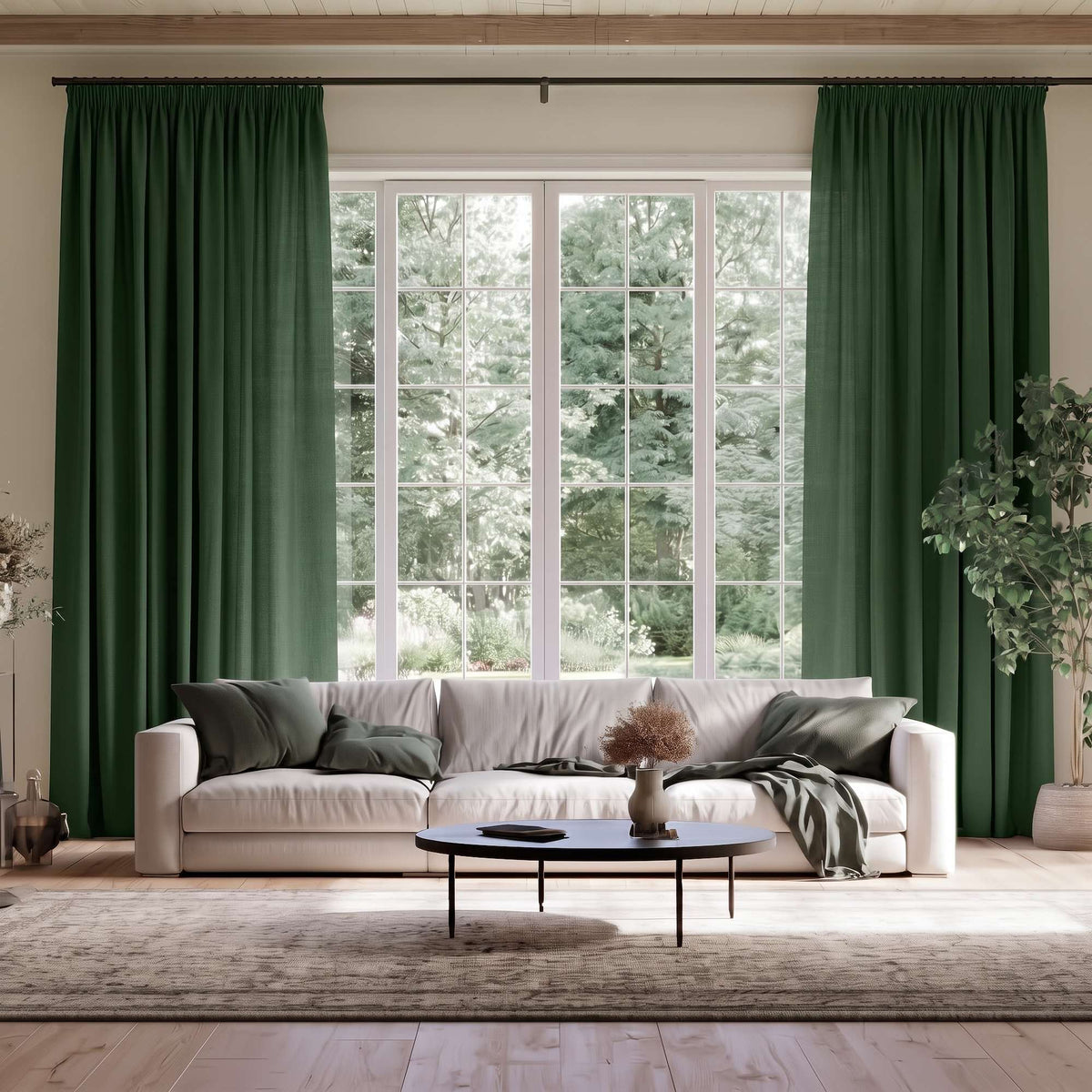 Forest Green Linen Pencil Pleat Extra Long Curtains in a Transitional Living Room with White Sofa, Green Pillows, and a Round Black Coffee Table