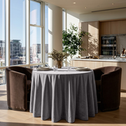 Grey Velvet Round Tablecloth in a Bright Kitchen Dining Area with Soft White Walls and Brown Velvet Chairs