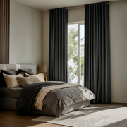 Dark Grey Velvet Grommet Curtains in a Modern Bedroom with Layered Neutral Bedding