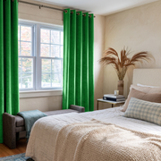 Lime Green Velvet Grommet Curtains in a Cozy Bedroom with Cream Walls and White Bedding