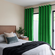 Lime Green Velvet Grommet Curtains in a Modern Bedroom with Beige Walls and Gray Bedding