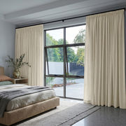 Ecru Heavy Weight Linen Pencil Pleat Bedroom Curtains in a Bright Modern Bedroom with Light Grey Walls
