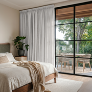 Off-White Heavy Weight Linen Pencil Pleat Curtains in a Serene Natural Bedroom with Warm Wood Accents
