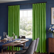 Vibrant floor Light Green curtains framing a large window in a stylish navy blue dining room