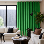 Lime Green Velvet Grommet Curtains in a Contemporary Living Room with Cream Sofas and Black Accents
