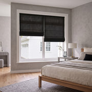 Black Roman Shades in a modern bedroom with grey-painted walls