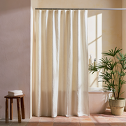 Cream Linen Button Hole Top Weighted Shower Curtain in a Bathroom with Terracotta Floor Tiles