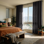 Charcoal Grey Linen Grommet Curtains in a Cozy Bedroom with Beige Walls
