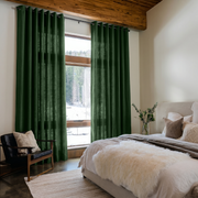 Forest Green Linen Grommet Bedroom Curtains in a Cozy Rustic Bedroom with Wood Plank Ceiling, a Plush Faux Fur Throw and Taupe Accents