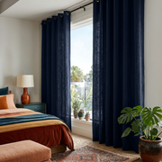 Royal Blue Linen Grommet Curtains in a Warm Bedroom with Soft White Walls