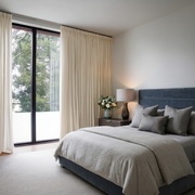 Cream Linen Pencil Pleat Curtains in a Calm Minimal Bedroom with Layered Textures