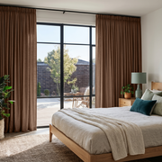 Tawny Brown Linen Pencil Pleat Bedroom Curtains in a Warm Contemporary Bedroom
