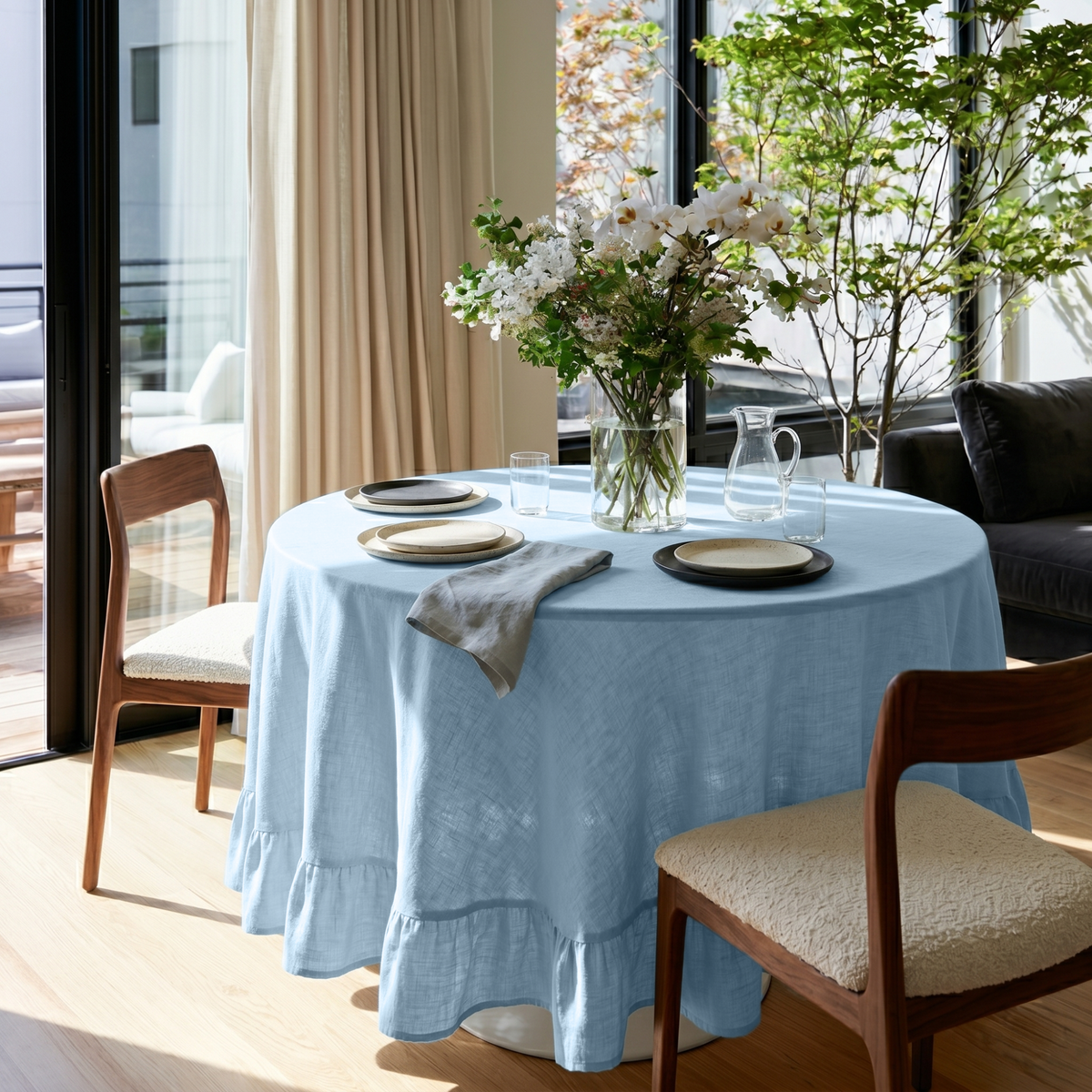 Sky Blue Linen Round Ruffle Tablecloth in a Bright Dining Room with Cream Curtains