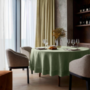 Asparagus Green Linen Round Tablecloth in a Modern Dining Room