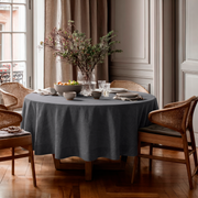 Dim Grey Linen Round Tablecloth in an Elegant Dining Room with Blush Wall Paneling and Warm Wood Accents