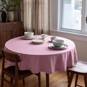 Dusty Rose Linen Round Tablecloth in a Cozy Dining Room with Soft Beige Walls and Walnut Wood