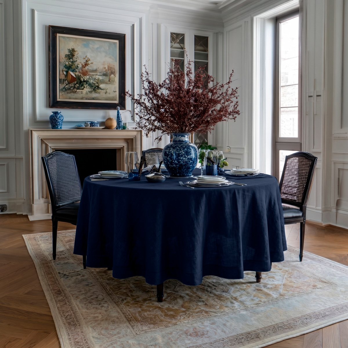 Royal Blue Linen Round Tablecloth in an Elegant Dining Room with White Wall Paneling and Blue Ceramic