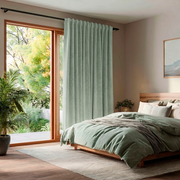 Mint Green Velvet Back Tab Blackout Curtains for Sliding Doors in a Bedroom with Beige Walls