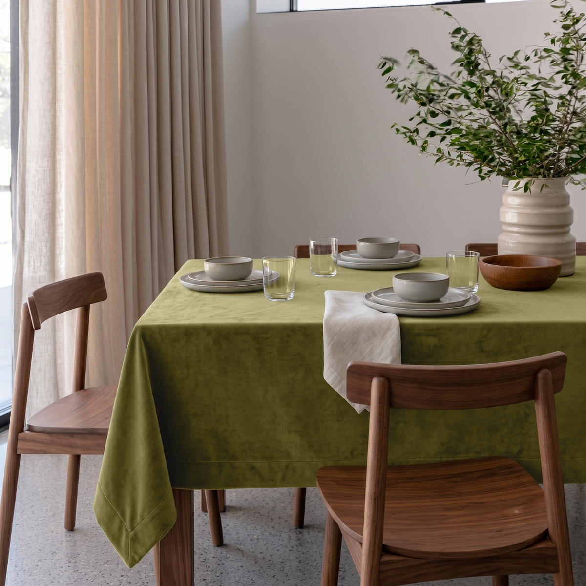 Moss Green Rectangular Velvet Tablecloth in a Contemporary Dining Room with Walnut Chairs and Beige Curtains