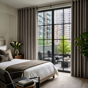 Natural Heavy Weight Linen Grommet Bedroom Curtains in an Elegant Urban Bedroom with Pale Neutral Walls and Charcoal Accents - Blackout Lining