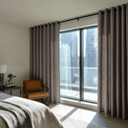 Natural Heavy Weight Linen Grommet Bedroom Curtains in a Minimal Bedroom with Warm Neutral Walls and Leather Chair - Cotton Lining