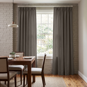 Natural Heavy Weight Linen Pinch Pleat Curtains in a Modern Farmhouse Dining Room with Brick Accent Wall and Upholstered Chairs