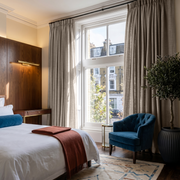 Natural Linen Pencil Pleat Curtains in a Classic Bedroom with Rich Wood Details - Cotton Lining