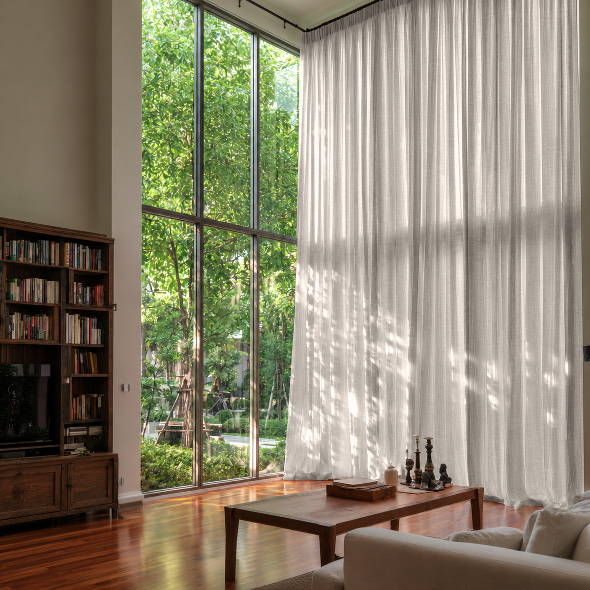 Natural Linen Pencil Pleat Extra Long Curtains in a Contemporary Living Room with Floor-to-Ceiling Windows and Built-In Bookshelves