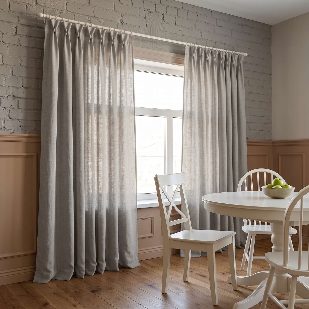 Natural Linen Pinch Pleat Curtains in a Dining Room with Grey Brick Walls, a White Table and Matching Wooden Chairs.