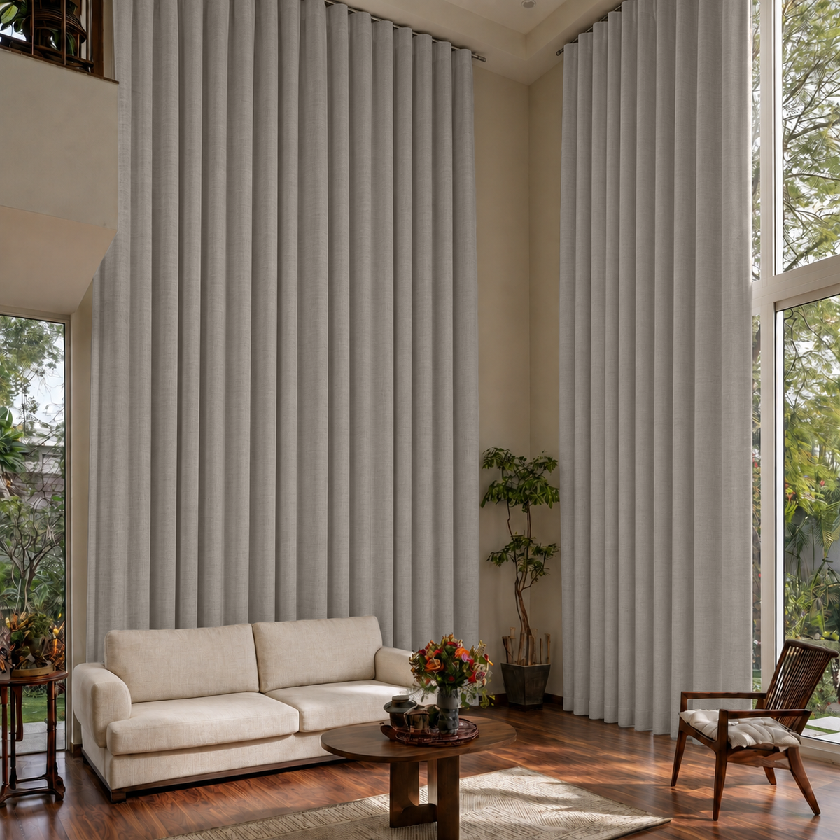 Natural Linen S-Fold Extra Long Curtains in a Modern Double-Height Living Room with Neutral Furniture and Wood Flooring