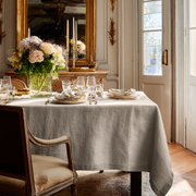 Natural Rectangular Linen Tablecloth in a Traditional Dining Room with Gilded Mirror and Floral Centerpiece
