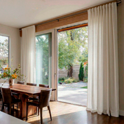 Off-White Heavy Weight Linen Back Tab Curtains for Sliding Doors in a Dining Room with Cream Walls
@Heading: Back Tabs