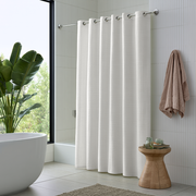 Off-White Heavy Weight Linen Hookless Weighted Shower Curtain in an Elegant Bathroom with Natural Wood and Greenery
