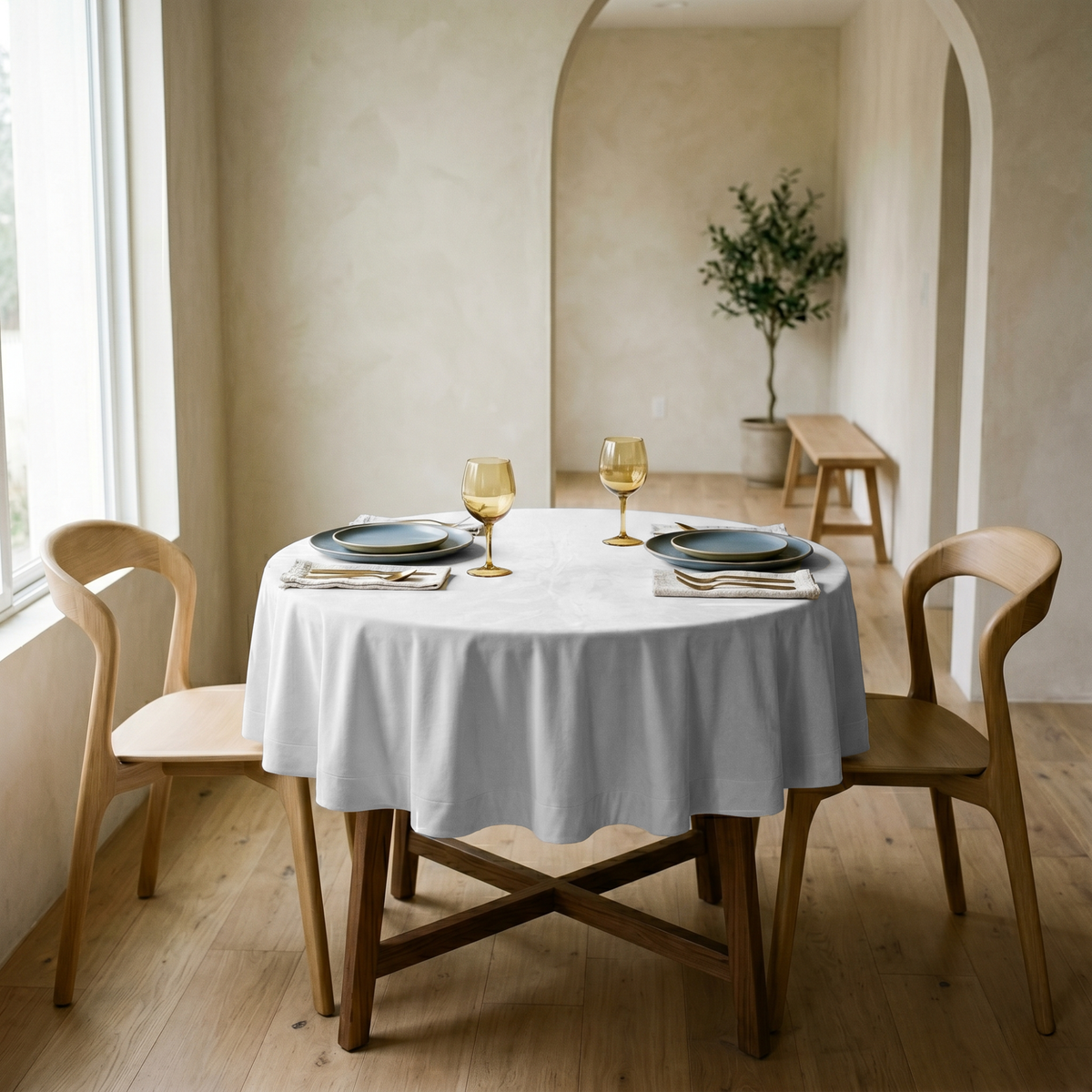 Off-White Small Velvet Round Tablecloth in a Minimal Dining Room with Beige Plaster Walls and Light Wood
